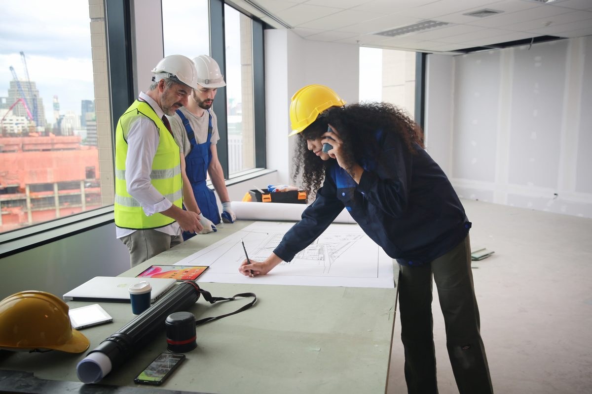 Contractors reviewing plans during a commercial build-out